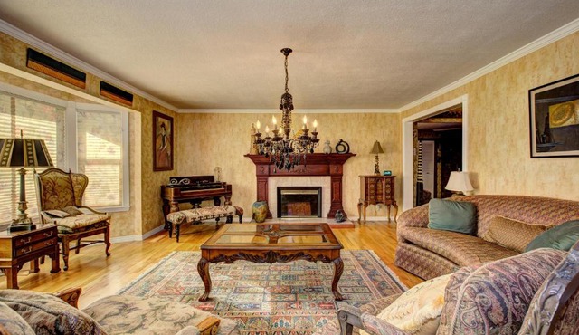 The Doll House an eclectic style of art and old fashioned doll and antique collections in a doll house designed home in Boise's desirable North End across from a nice park with tennis and basement and walking trails near shopping, hiking, biking, skiing in Boise