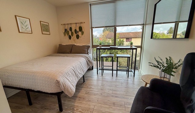 Urban studio unit with patio views, shared lounge space and dedicated workspace in Seattle